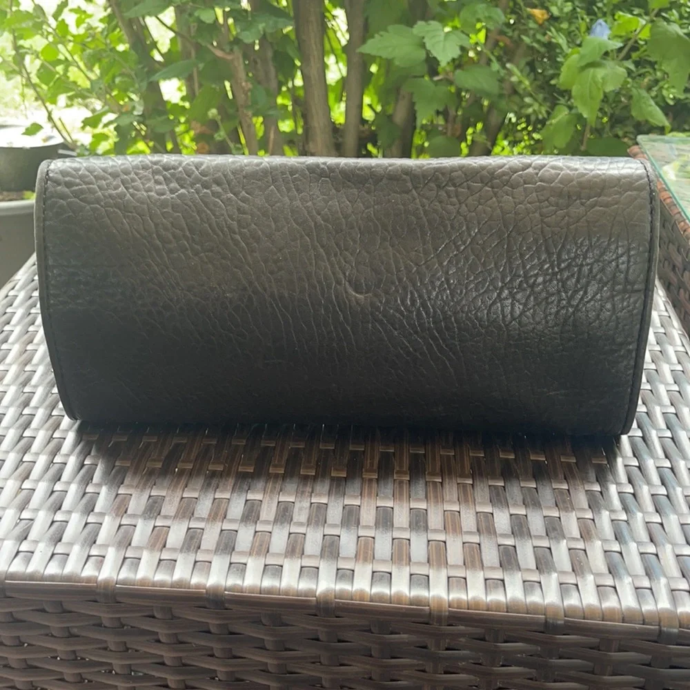 Michael kors Pebbled leather MK clutch with gun metal zipper.